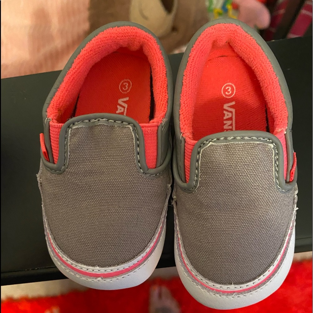 Toddlers slip on Vans sneakers